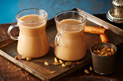 Conjure up the taste of New Delhi with this warming recipe for chai, a lightly spiced and aromatic milky black tea. Fresh ginger and spices are boiled in water, then tea, milk and sugar are added to taste.