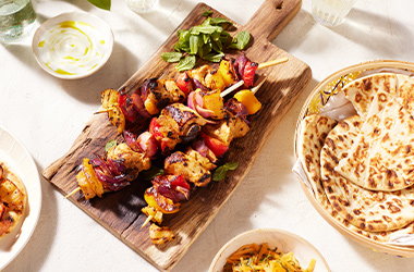 Spiced chicken skewers with carrot and mint salad