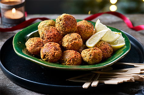 Hosting a Christmas party this year? Make these baked falafel bites for a gluten-free and vegan canapé - simply blitz in a food processor and bake until irresistibly crisp and golden.