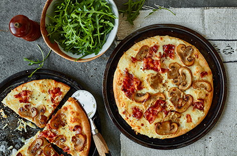 For a true Friday night treat, this carbonara pizza recipe beats any takeaway and it's ready in half an hour! This indulgent dinner has it all – a creamy base, caramelised mushrooms, crispy bacon and plenty of melting mozzarella.