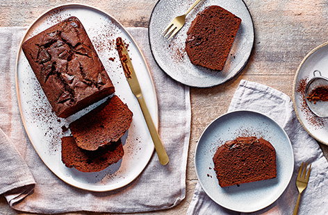 This simple chocolate loaf cake recipe is the perfect easy baking recipe for new bakers. Rich and fluffy chocolate cake is studded with melting chunks of dark chocolate and all made in just one bowl for cake ready in an hour!