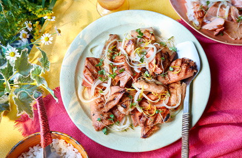 Introduce your grill to something new. Chunks of salmon are coated in a Korean-inspired marinade made from soy sauce and sesame oil. Serve with a zesty onion salad for punchy barbecue dish everyone will love.