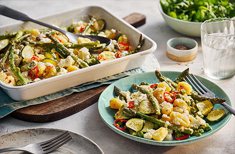 We've give the viral feta traybake a seasonal twist for spring! Bake asparagus, courgettes and peas with creamy feta and gnocchi all in on tray. Top with a drizzle of hot honey on top if you like a bit of spice. Ready in just 25 minutes, this flavourful dish is perfect for a speedy spring meal.