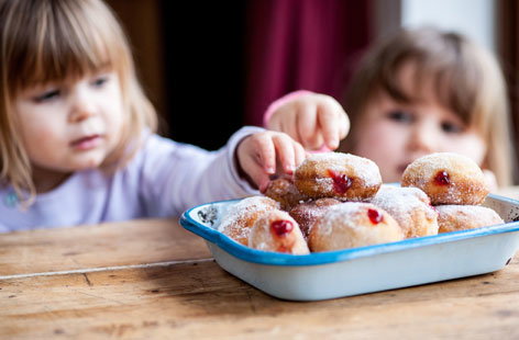 These light and delicious jam-filled doughnuts are so fun to make, with lots of opportunities for children to practice their kneading, rolling and piping skills.