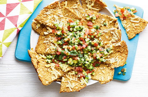 Keep the kids happy over the summer holidays with this Mexican-inspired healthy snack recipe. Making your own nachos from spiced cauliflower instead of classic tortilla chips adds an extra portion of veg, perfect for pairing with the fresh colourful salsa.