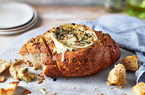 This easy, cheesy bread is perfect for a get-together. A cheat’s fondue, the bread acts as the bowl and accompaniment for the oozy honey, garlic and thyme Camembert
