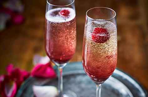 This timeless cocktail is traditionally made with Champagne and peach puree, but this alternative Bellini recipe uses sparkling wine and forest fruit coulis for a pretty Valentine's twist