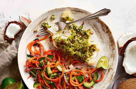 Using a whole fresh coconut in this Thai-inspired fish dish maximises on the tropical flavour – and baking it for just 15 minutes shrinks the flesh from the shell, making it easier to remove. 