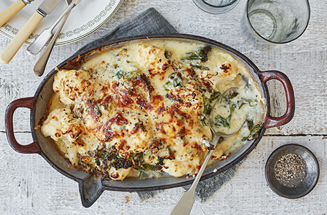 Creamy cauliflower cheese is one of those sides that always steals the show. We've added crispy kale and a gooey blend of cheddar, manchego and hard cheese for a heavenly bake that will transform your roast dinner.