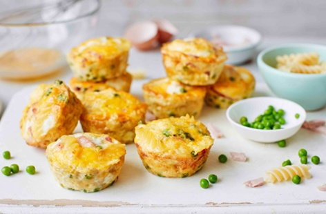 Healthy snacks for kids don't get much more satisfying than this! Packed with hearty fusilli pasta, shelled peas, thick-cut ham and fresh eggs these simple baked frittatas are really easy to make and perfect for the kids to enjoy whilst out and about 