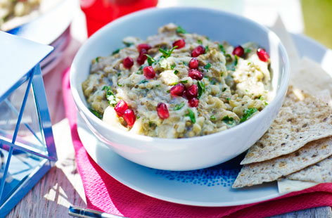This take on a Middle Eastern baba ganoush is the ideal dip to accompany any picnic you've been planning. Charring the aubergines till they're just on the right side of burnt is what gives the dip its unqiue smoky flavour. Scatter with pomegranate seeds and serve.