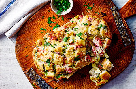 Make your mission against food waste fun with this garlic loaf made up of leftover odds and ends. Load up a sourdough loaf with garlic, mayo, mozzarella and chunks of ham, bake until the mozzarella is perfectly melted, then let everybody dig in!